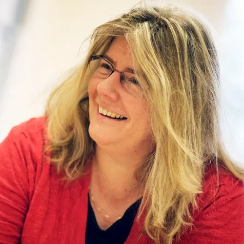 Dawn Grey, a Holistic Sleep Coach, smiling.